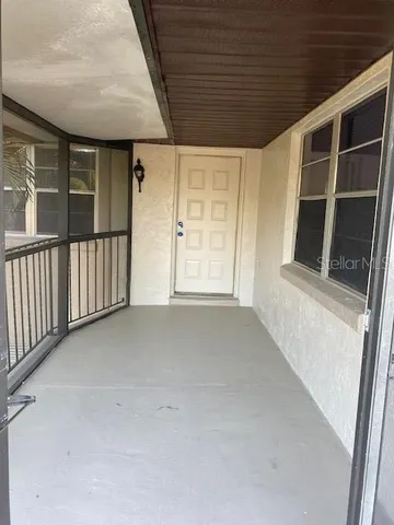a view of empty room with windows