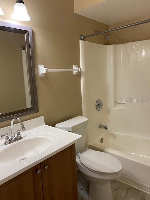 92 Windtree Lane, Unit 201 Winter Garden, FL 34787 - Photo 10 of 17 a bathroom with a sink a toilet and shower