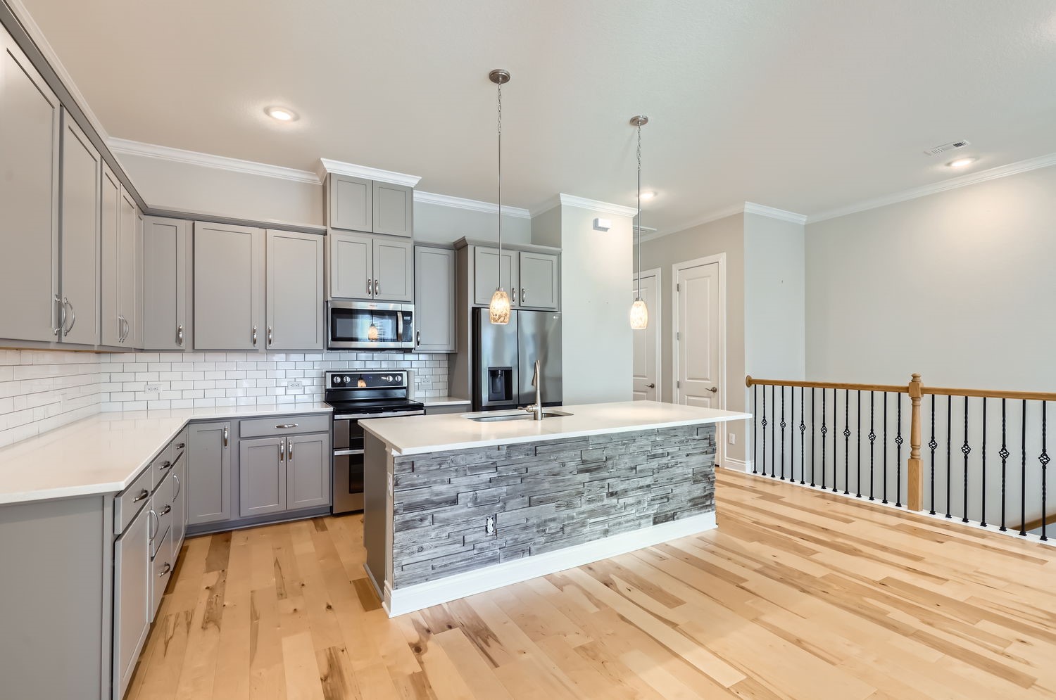 348 Adams Street Georgetown, TX 78628 - Photo 2 of 11 Large kitchen with tons of storage and open to dining area and balcony.