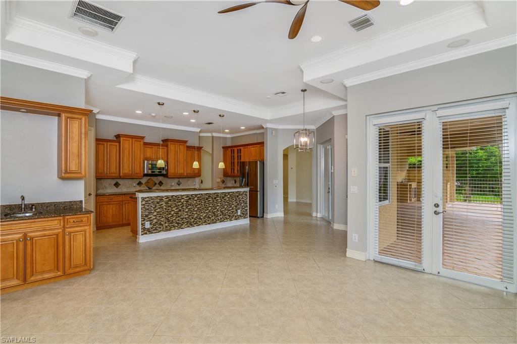 4430 Pine Ridge Road Naples, FL 34119 - Photo 15 of 35 a large en suite bathroom with a tub a double vanity sink and mirror