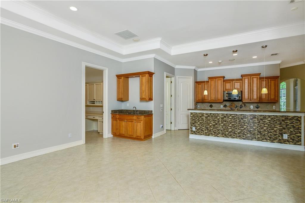 4430 Pine Ridge Road Naples, FL 34119 - Photo 16 of 35 a living room with furniture