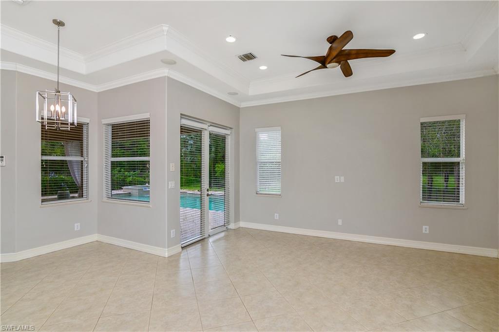 4430 Pine Ridge Road Naples, FL 34119 - Photo 18 of 35 a view of a livingroom with a ceiling fan and window