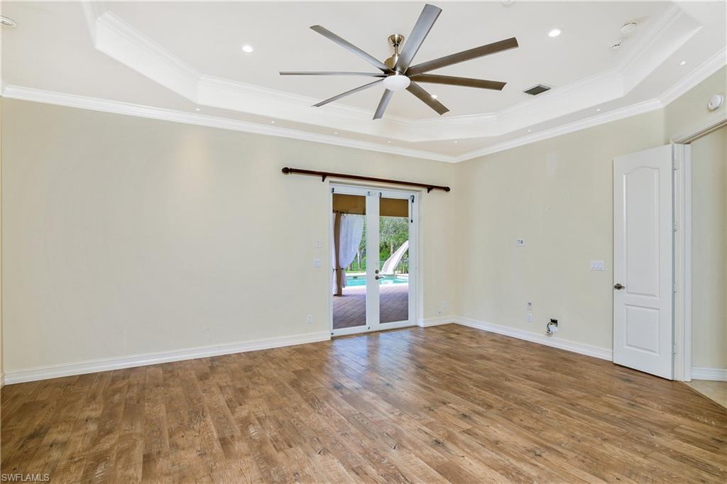 4430 Pine Ridge Road Naples, FL 34119 - Photo 20 of 35 wooden floor in an empty room with a window