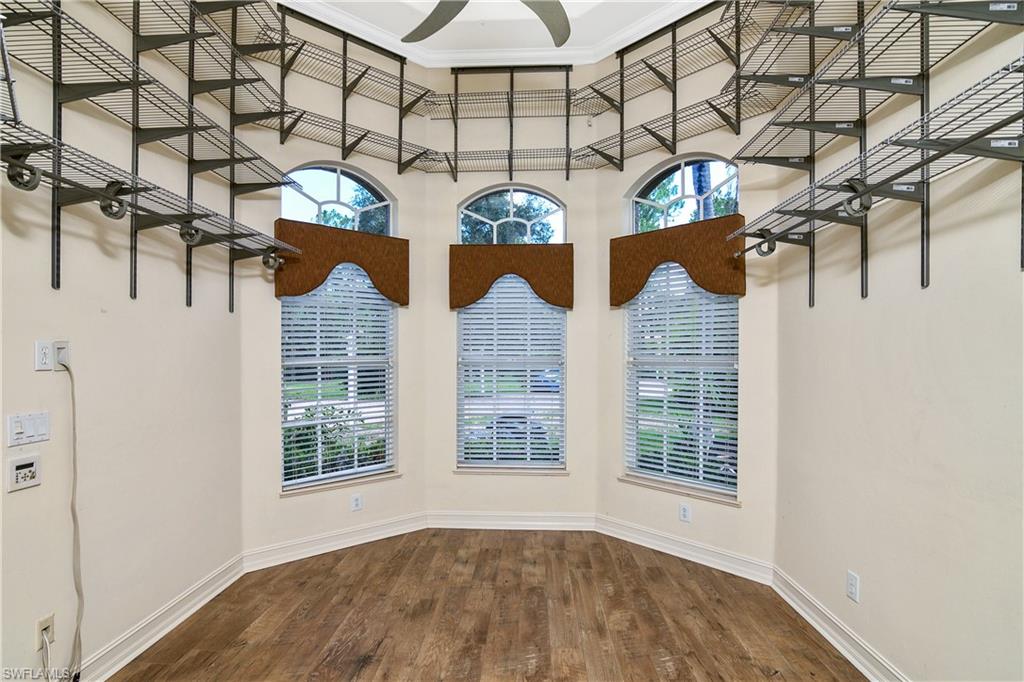 4430 Pine Ridge Road Naples, FL 34119 - Photo 22 of 35 a view of a room that has a window and brick walls