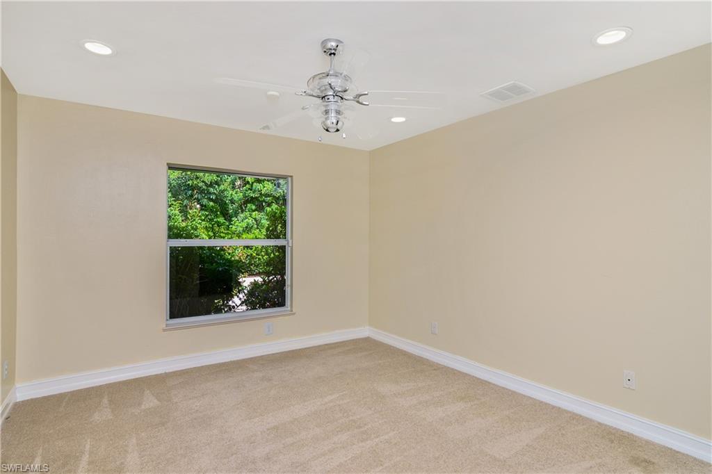 4430 Pine Ridge Road Naples, FL 34119 - Photo 25 of 35 an empty room with a window