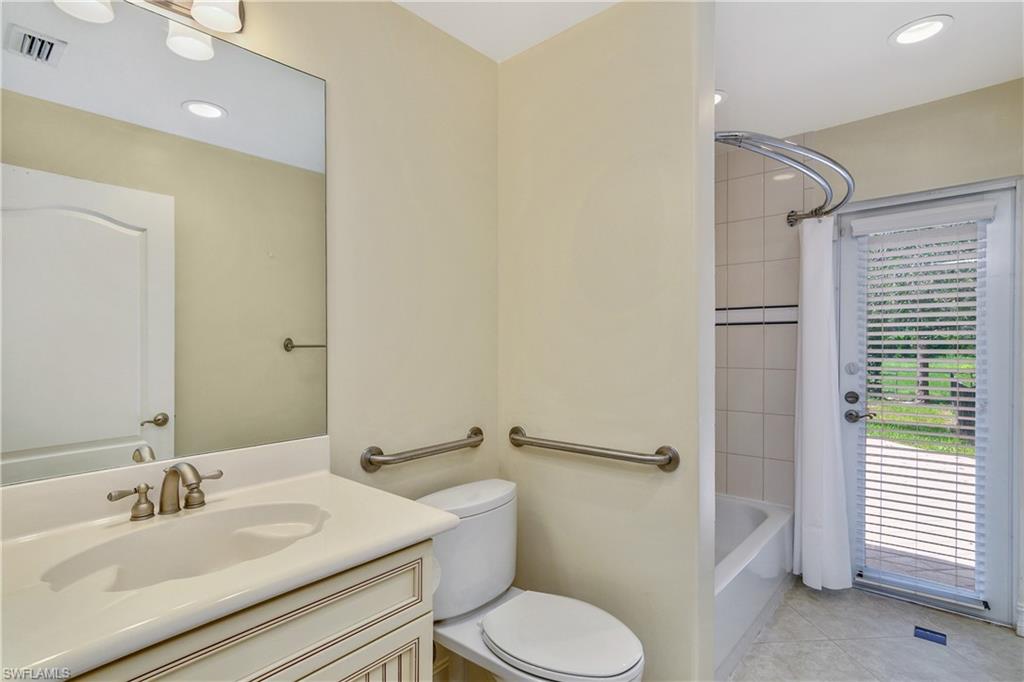 4430 Pine Ridge Road Naples, FL 34119 - Photo 26 of 35 a bathroom with a sink toilet and shower