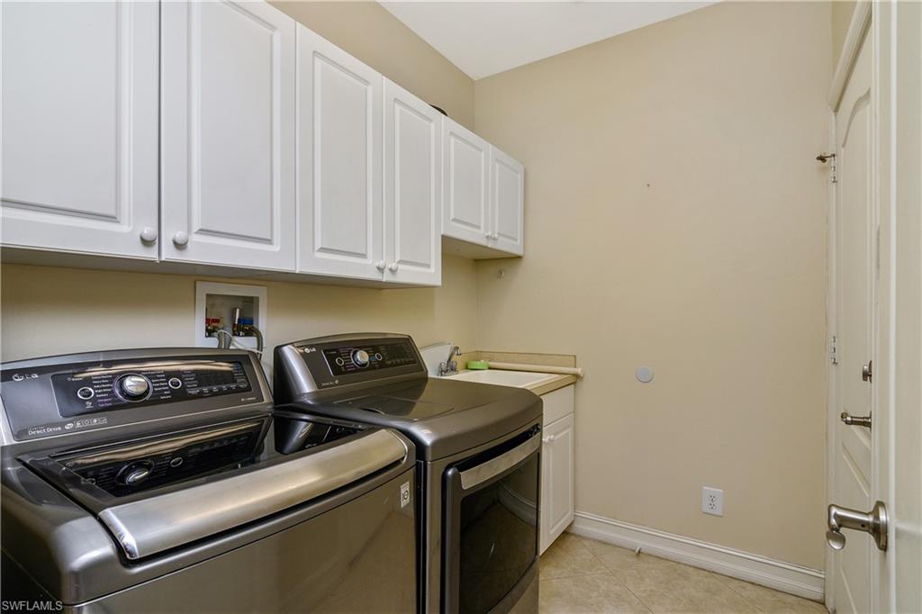 4430 Pine Ridge Road Naples, FL 34119 - Photo 28 of 35 a utility room with dryer and washer