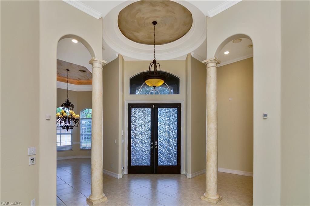 4430 Pine Ridge Road Naples, FL 34119 - Photo 6 of 35 a front view of a house with wooden floor