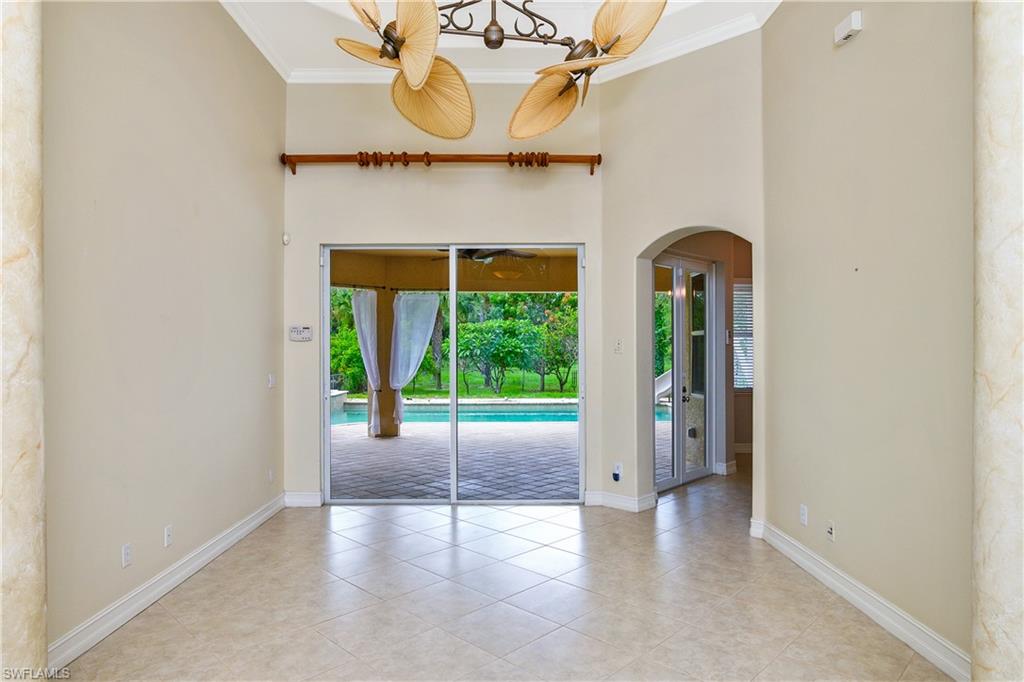4430 Pine Ridge Road Naples, FL 34119 - Photo 8 of 35 a view of an entryway with a fireplace