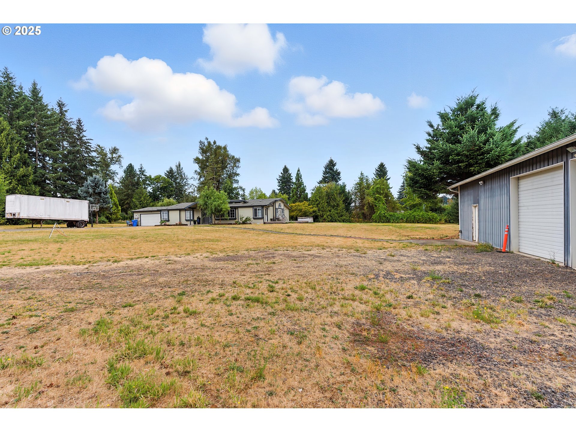 20160 Southeast Foster Road Damascus, OR 97089 - Photo 11 of 48 a backyard of a house with lots of green space