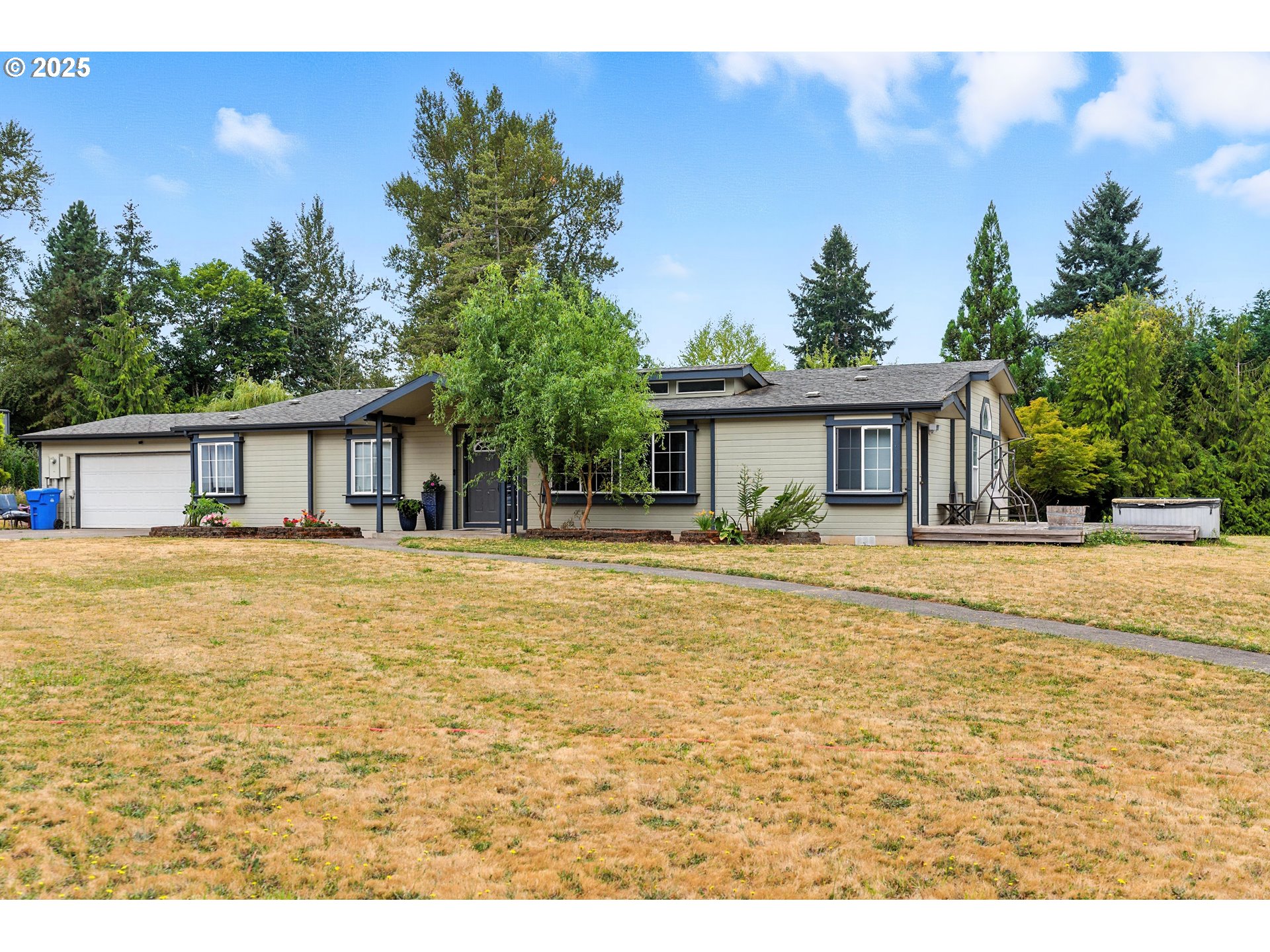 20160 Southeast Foster Road Damascus, OR 97089 - Photo 12 of 48 a front view of a house with a patio