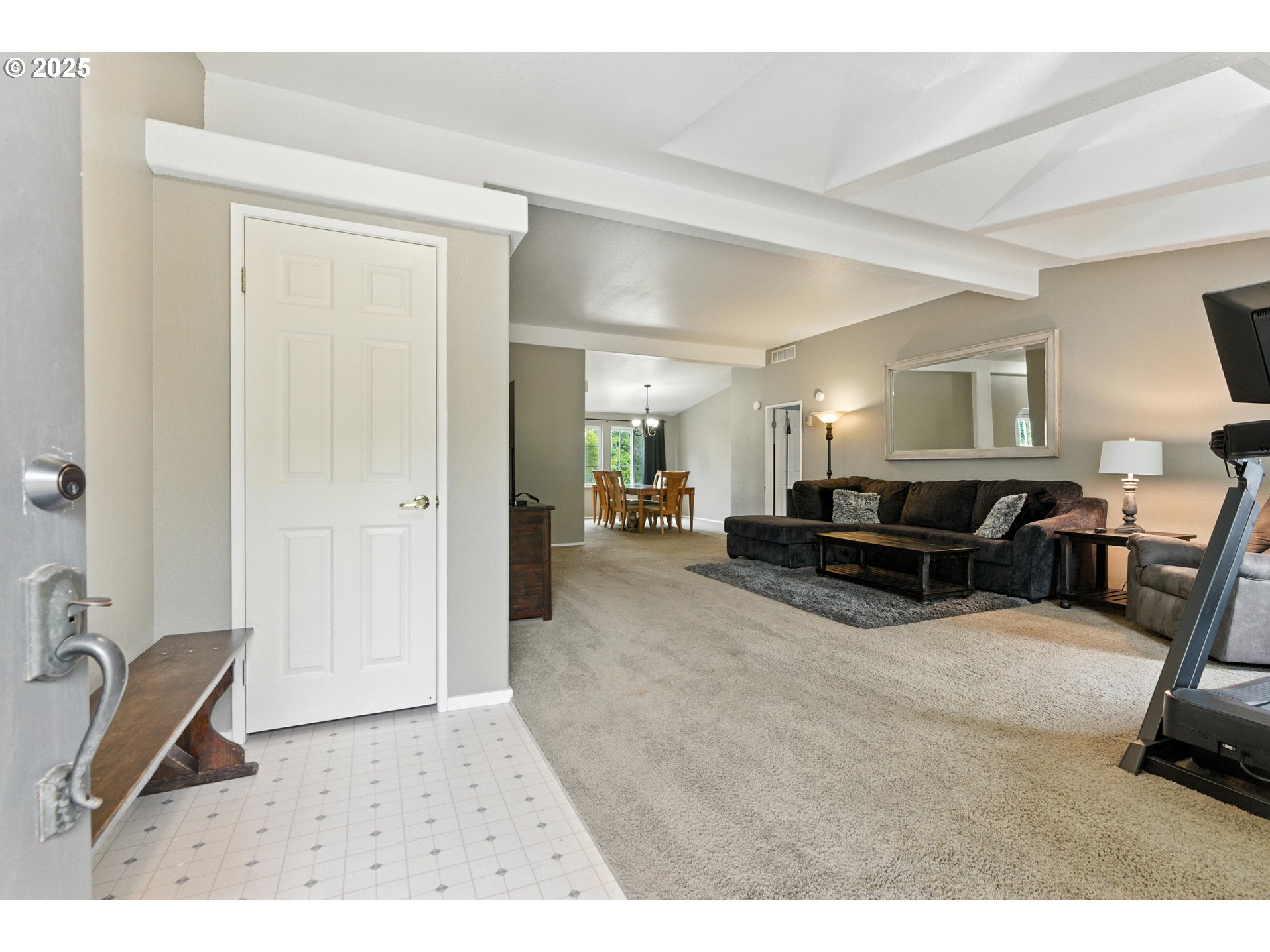20160 Southeast Foster Road Damascus, OR 97089 - Photo 13 of 48 a living room with furniture a flat screen tv and a refrigerator