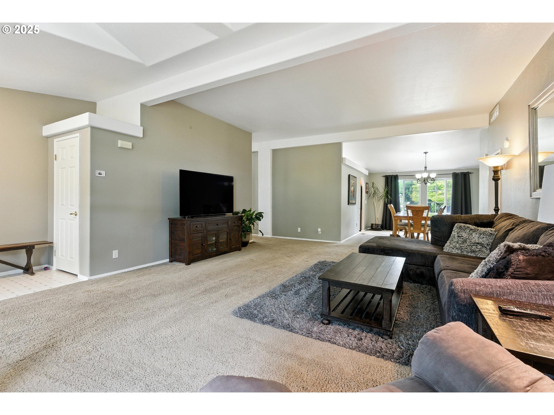 20160 Southeast Foster Road Damascus, OR 97089 - Photo 16 of 48 a living room with furniture and a flat screen tv