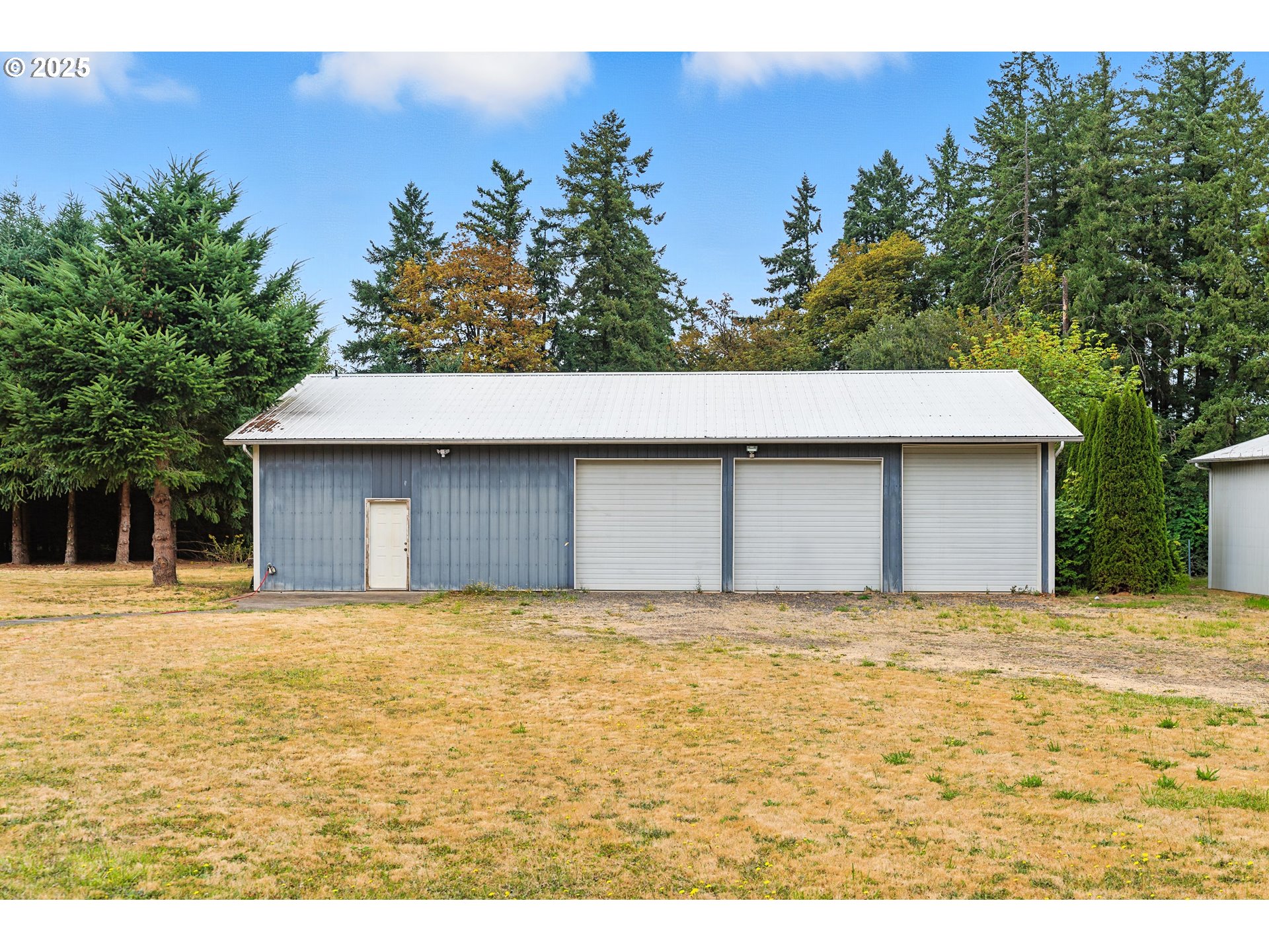 20160 Southeast Foster Road Damascus, OR 97089 - Photo 2 of 48 a house with trees in the background