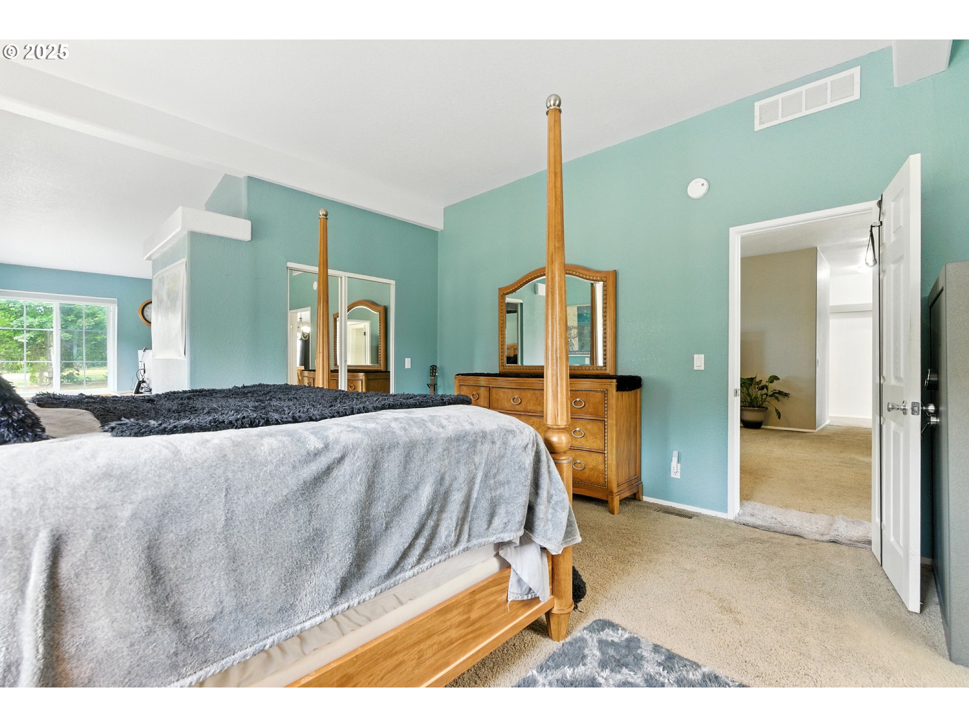20160 Southeast Foster Road Damascus, OR 97089 - Photo 21 of 48 a bed room with a bed and a view of living room