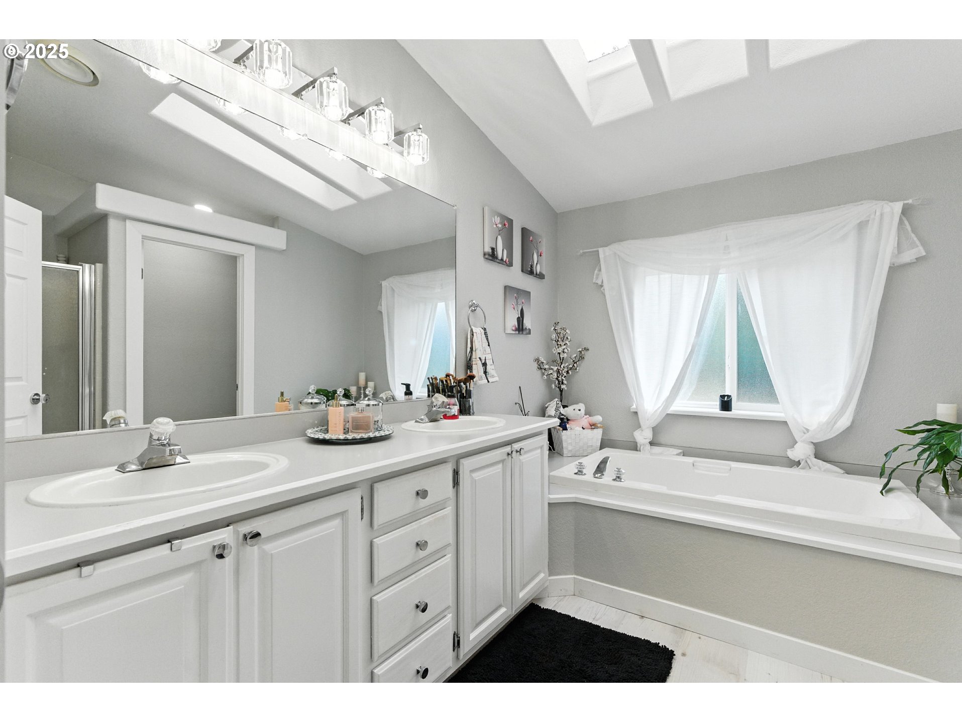 20160 Southeast Foster Road Damascus, OR 97089 - Photo 25 of 48 a bathroom with a sink vanity granite tub and a mirror