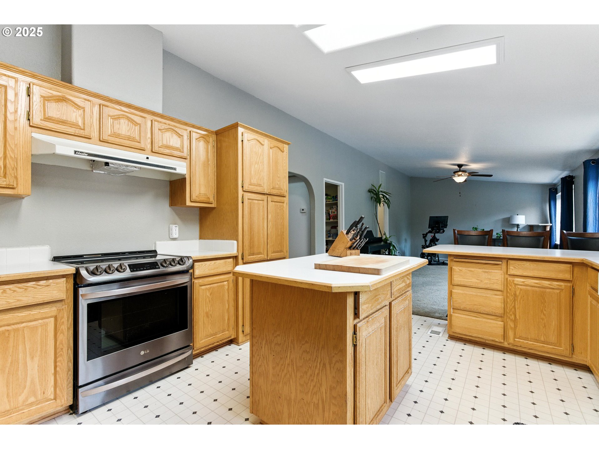 20160 Southeast Foster Road Damascus, OR 97089 - Photo 27 of 48 a kitchen with a stove a sink and a refrigerator