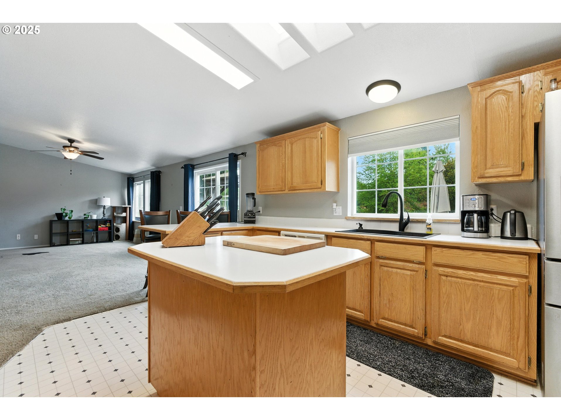 20160 Southeast Foster Road Damascus, OR 97089 - Photo 29 of 48 a kitchen with stainless steel appliances granite countertop a sink a stove and a refrigerator