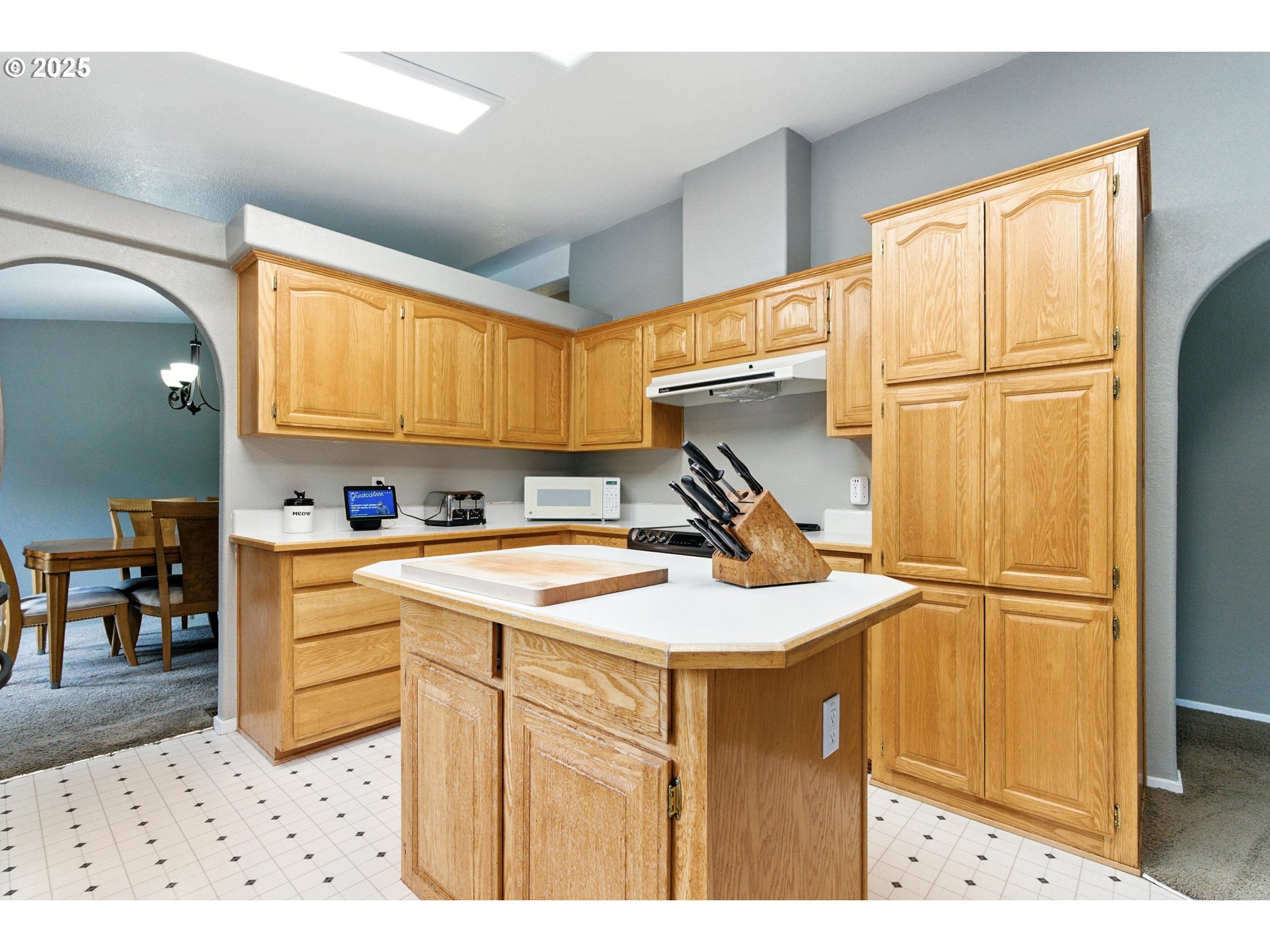 20160 Southeast Foster Road Damascus, OR 97089 - Photo 30 of 48 a kitchen with a sink a stove a refrigerator and cabinets