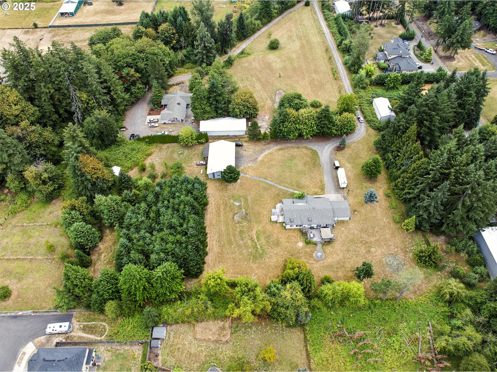 20160 Southeast Foster Road Damascus, OR 97089 - Photo 32 of 48 an aerial view of a house with a yard and lake view