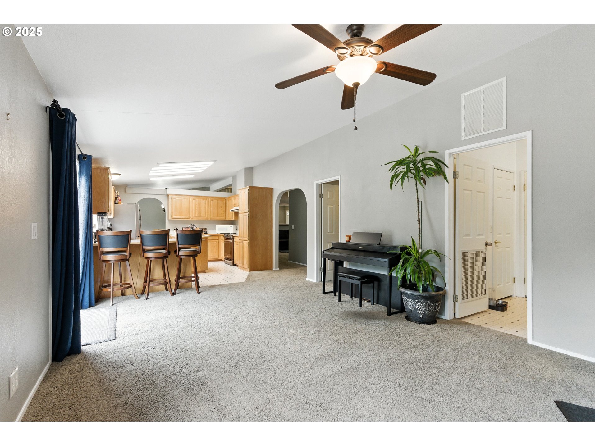 20160 Southeast Foster Road Damascus, OR 97089 - Photo 37 of 48 a living room with furniture and a chandelier