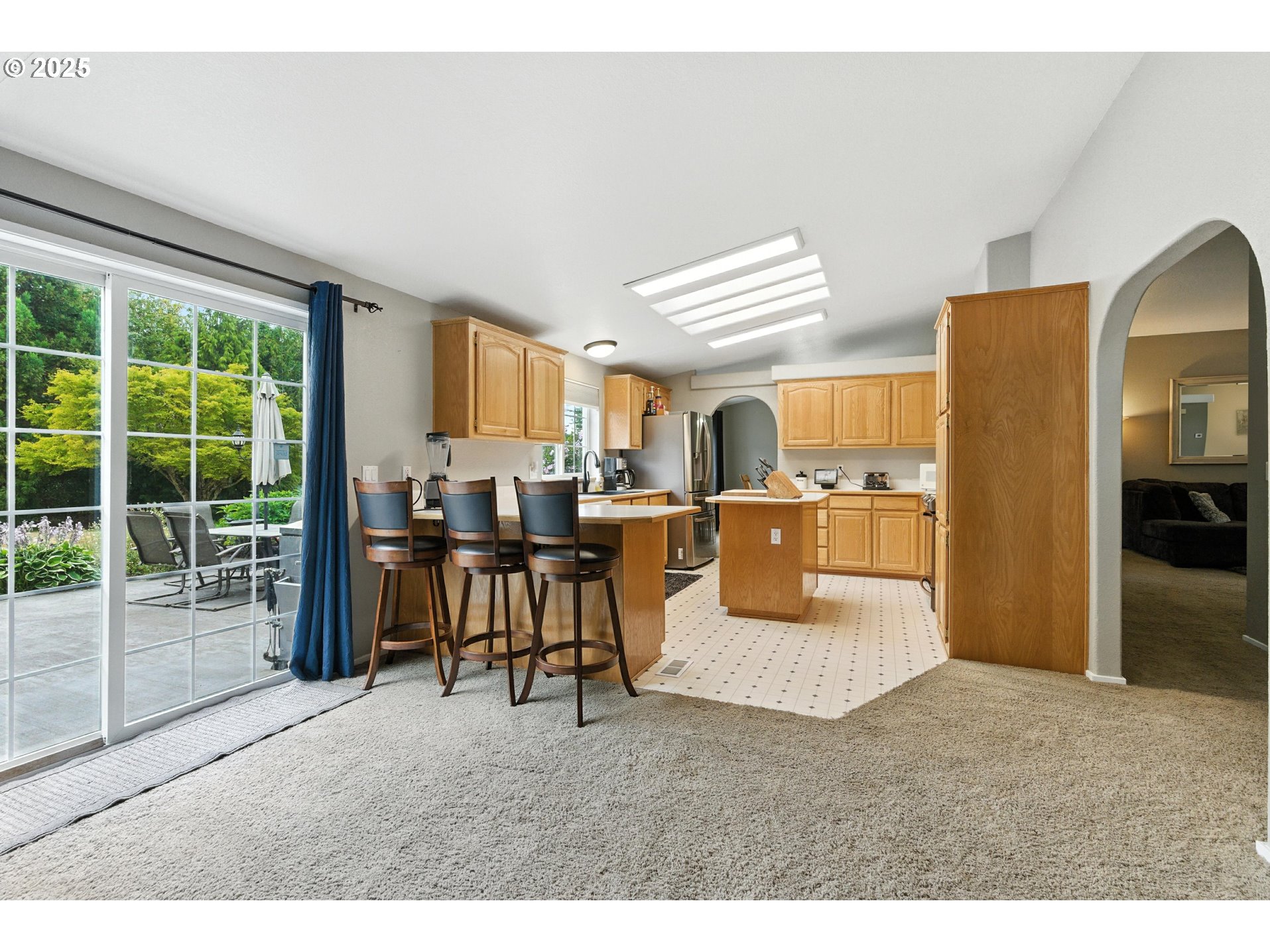 20160 Southeast Foster Road Damascus, OR 97089 - Photo 38 of 48 a living room with furniture and a kitchen area
