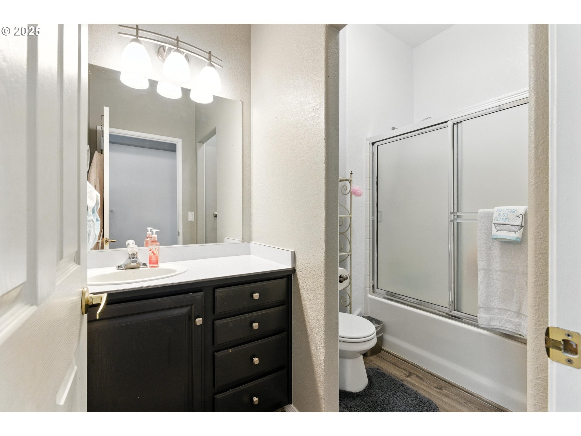 20160 Southeast Foster Road Damascus, OR 97089 - Photo 40 of 48 a bathroom with a double vanity sink toilet mirror and shower