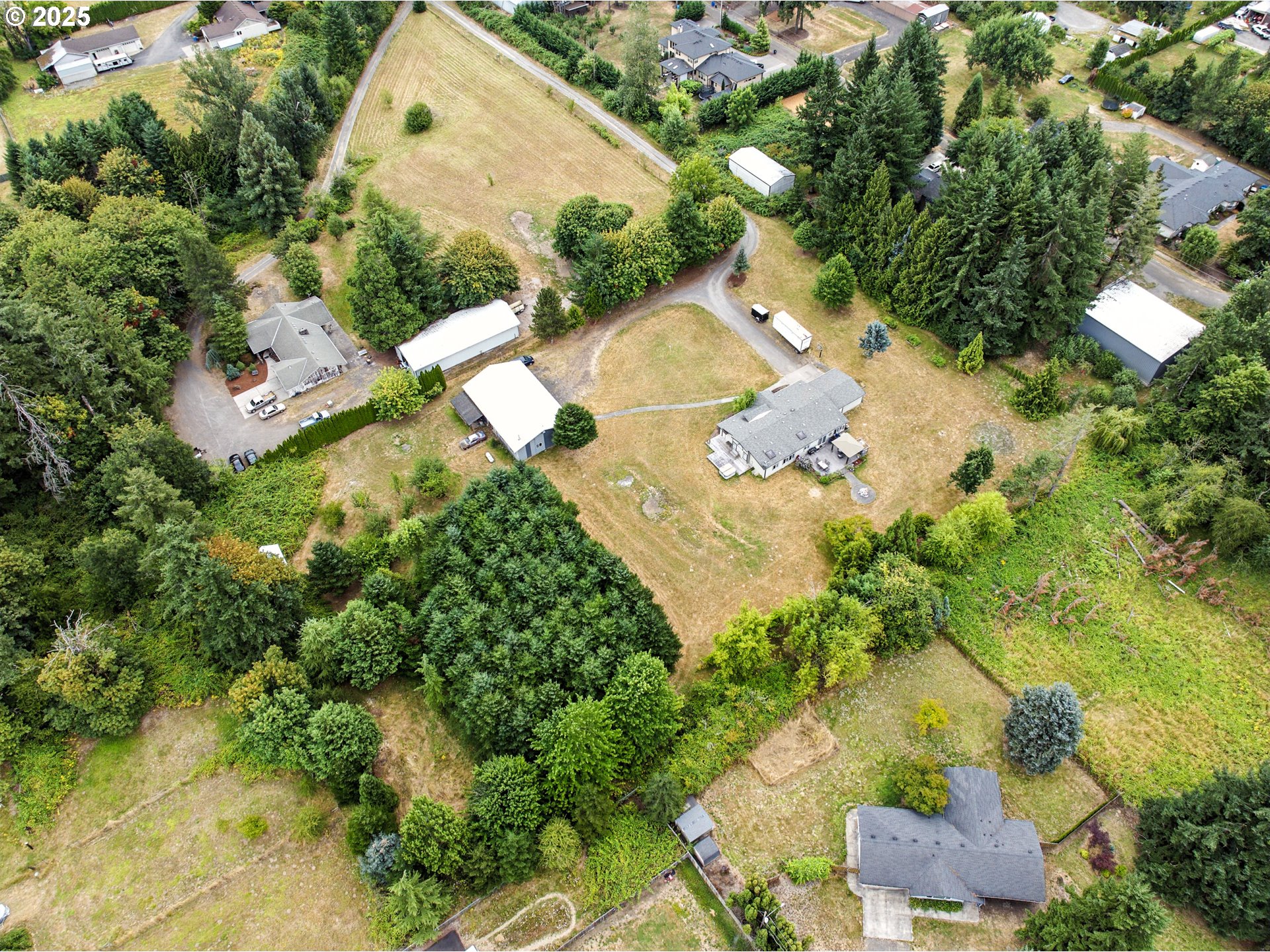 20160 Southeast Foster Road Damascus, OR 97089 - Photo 43 of 48 an aerial view of a house with yard swimming pool and outdoor seating