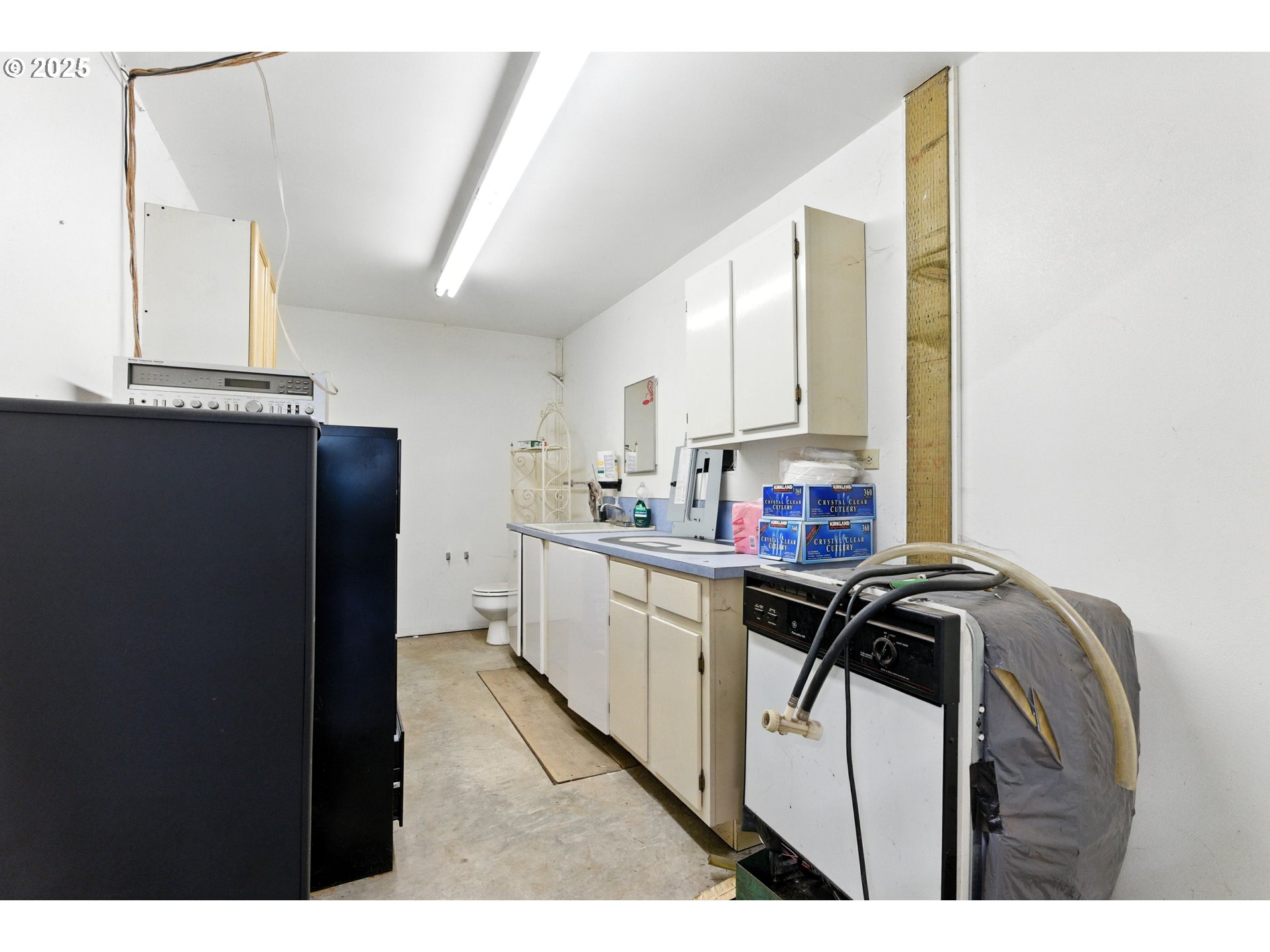 20160 Southeast Foster Road Damascus, OR 97089 - Photo 48 of 48 a kitchen with a refrigerator and a stove top oven