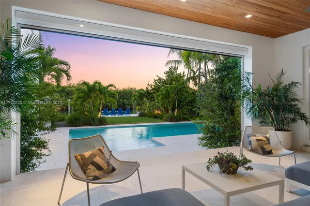 a kitchen with stainless steel appliances white cabinets and a stove
