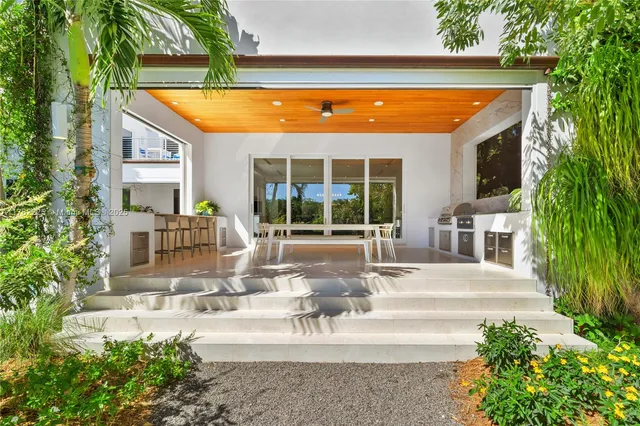 an aerial view of a house with a garden and plants