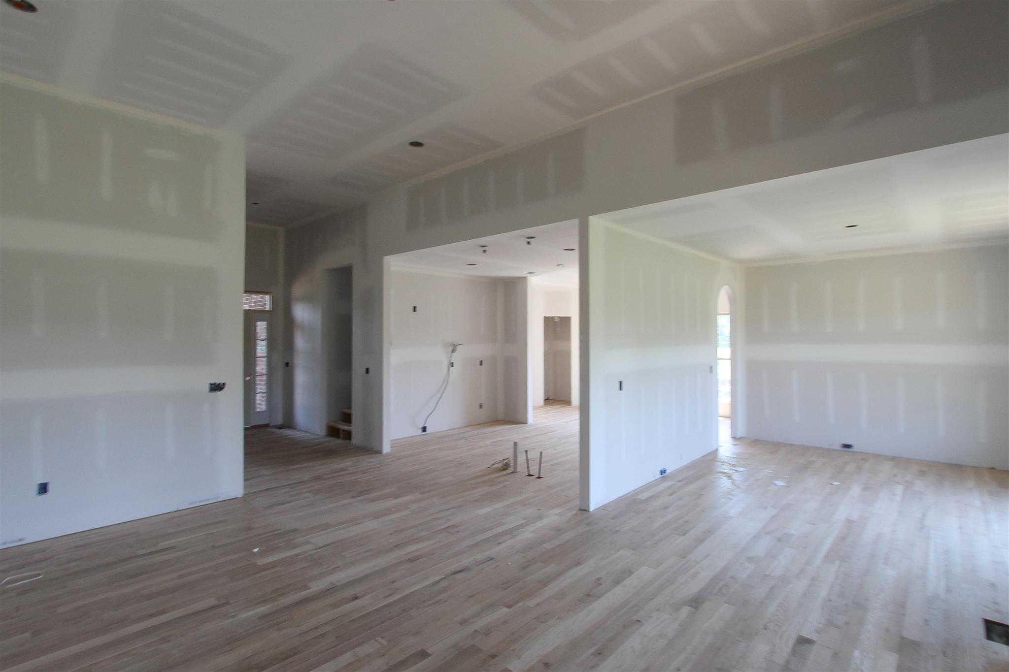 580 Academy Road, Unit 16 Lebanon, TN 37087 - Photo 3 of 3 an empty room with wooden floor & windows and bathroom
