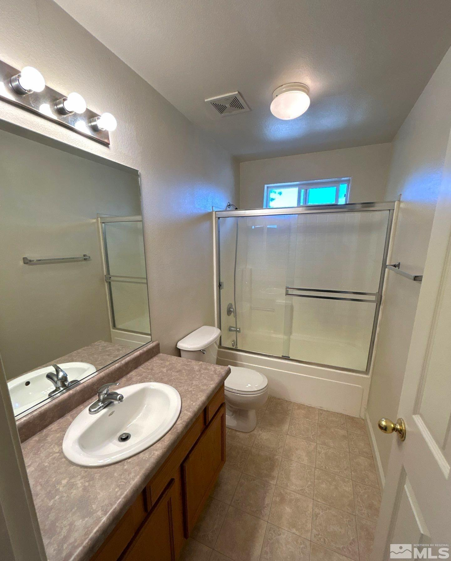 412 10th Street, Unit B Sparks, NV 89431 - Photo 12 of 13 a bathroom with a sink toilet and shower