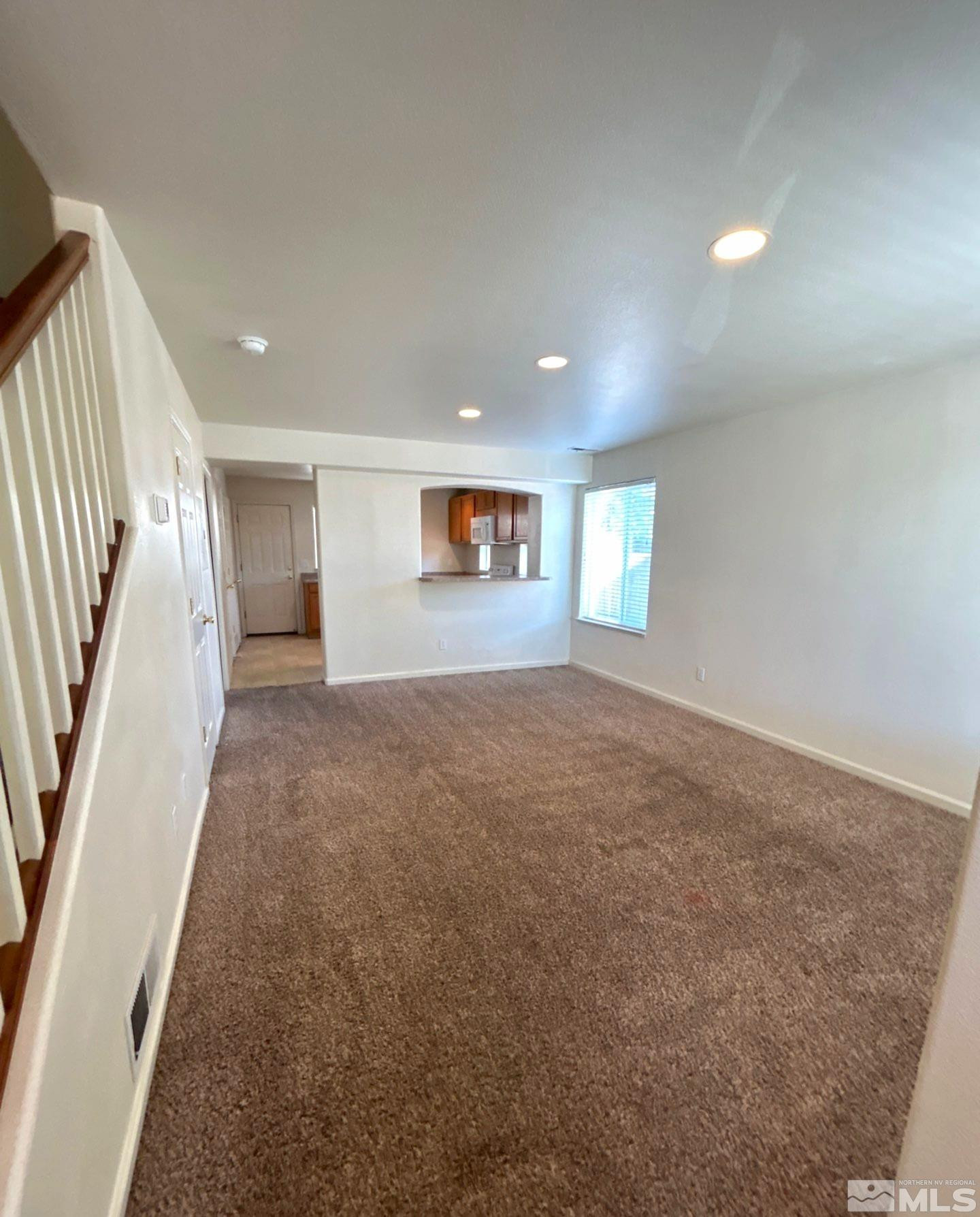 412 10th Street, Unit B Sparks, NV 89431 - Photo 2 of 13 an empty room with windows and entrance