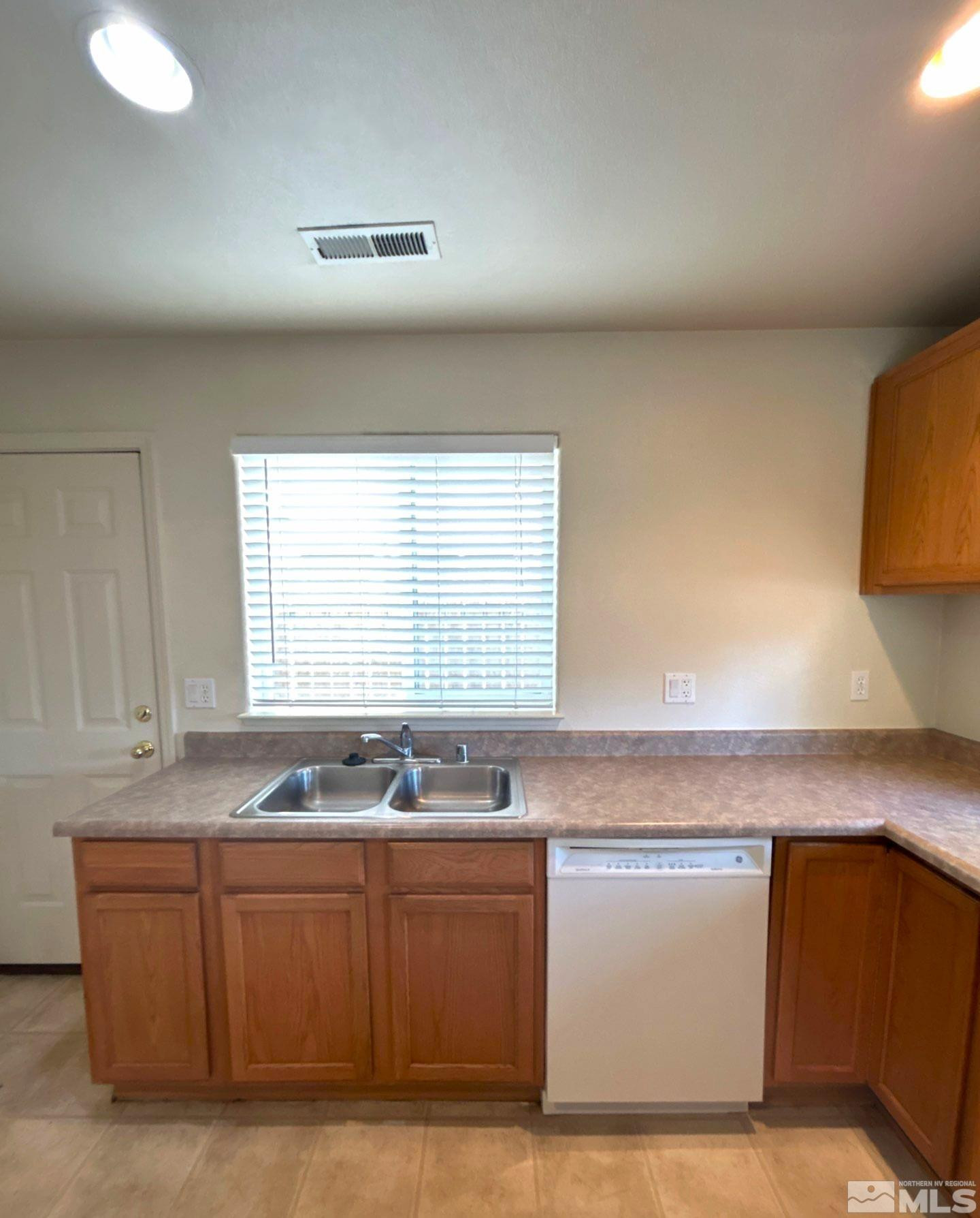 412 10th Street, Unit B Sparks, NV 89431 - Photo 6 of 13 a kitchen with granite countertop cabinets and window
