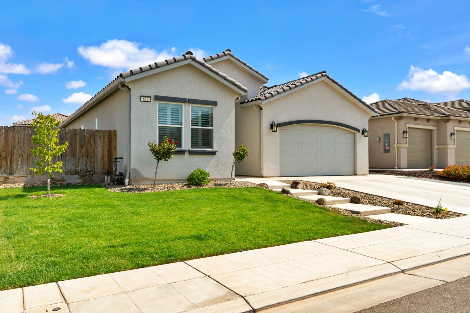 639 Mesa Drive Madera, CA 93636 - Photo 2 of 33 a view of a house with a yard