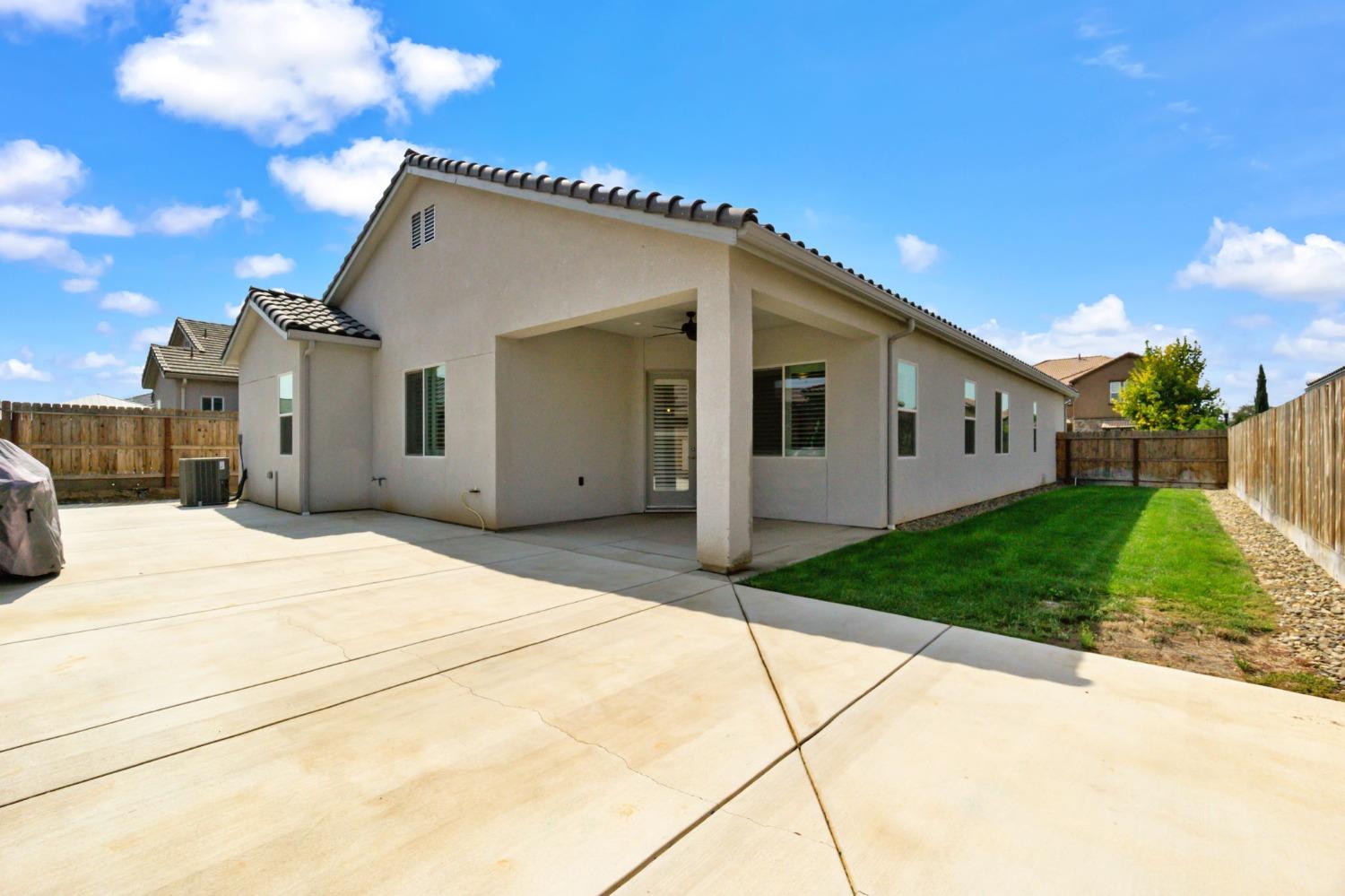 639 Mesa Drive Madera, CA 93636 - Photo 25 of 33 a view of a house with a yard