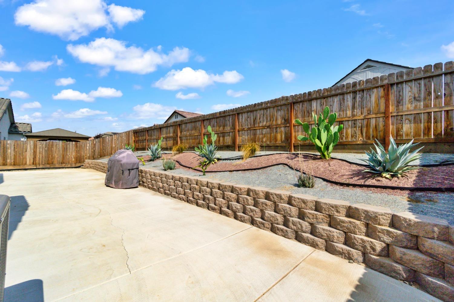 639 Mesa Drive Madera, CA 93636 - Photo 26 of 33 a view of a swimming pool with a lounge chair