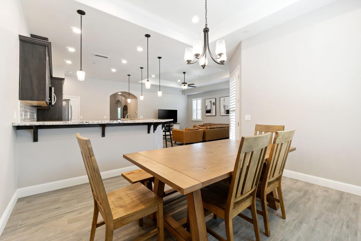 639 Mesa Drive Madera, CA 93636 - Photo 10 of 33 a large kitchen with a table and chairs