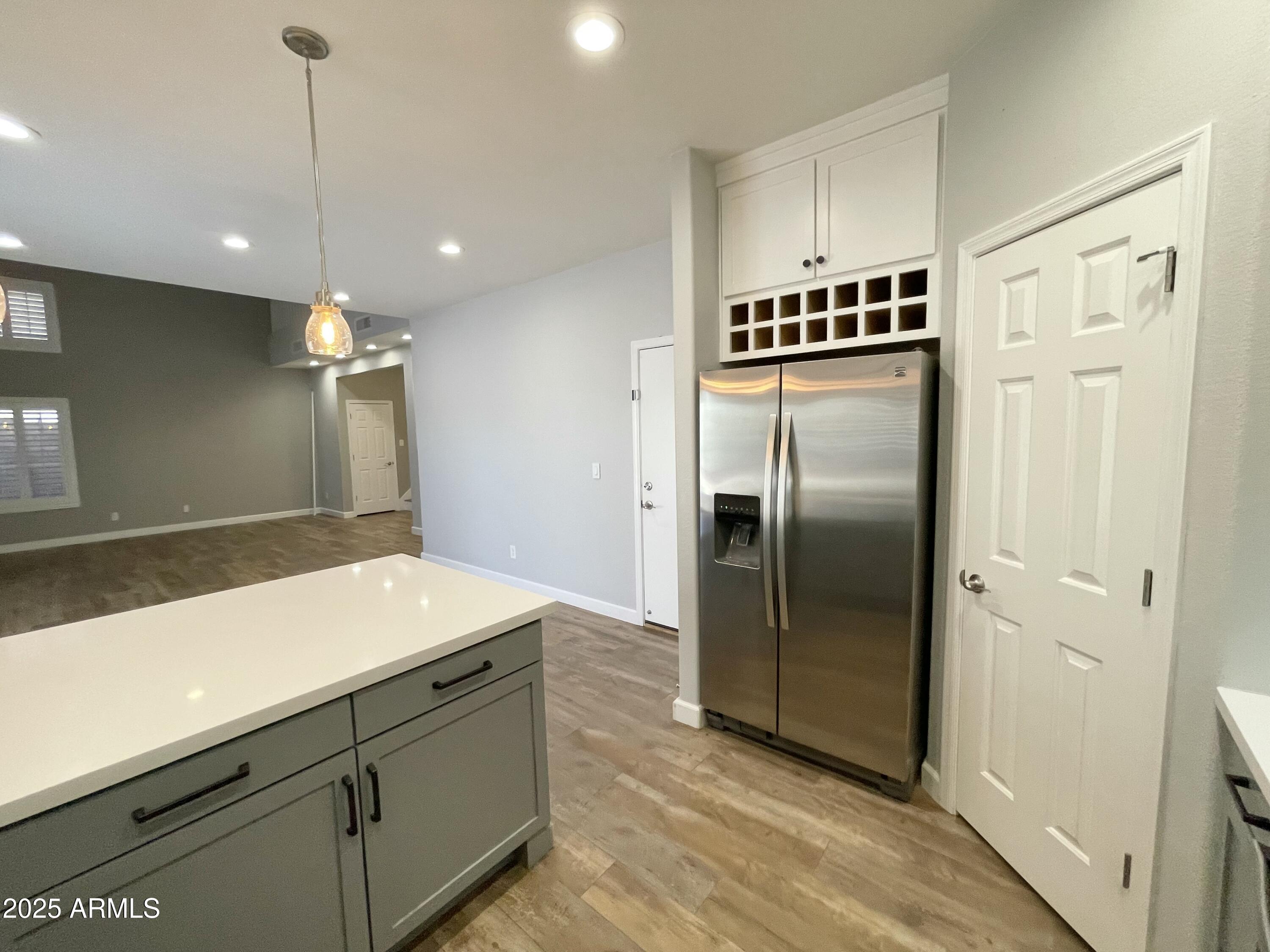 2640 East Indian Wells Place Chandler, AZ 85249 - Photo 12 of 40 a kitchen with stainless steel appliances a refrigerator and a sink