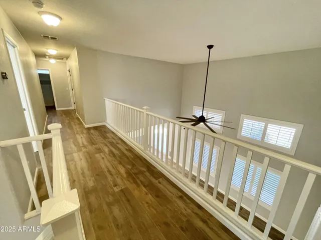 a view of staircase with white walls