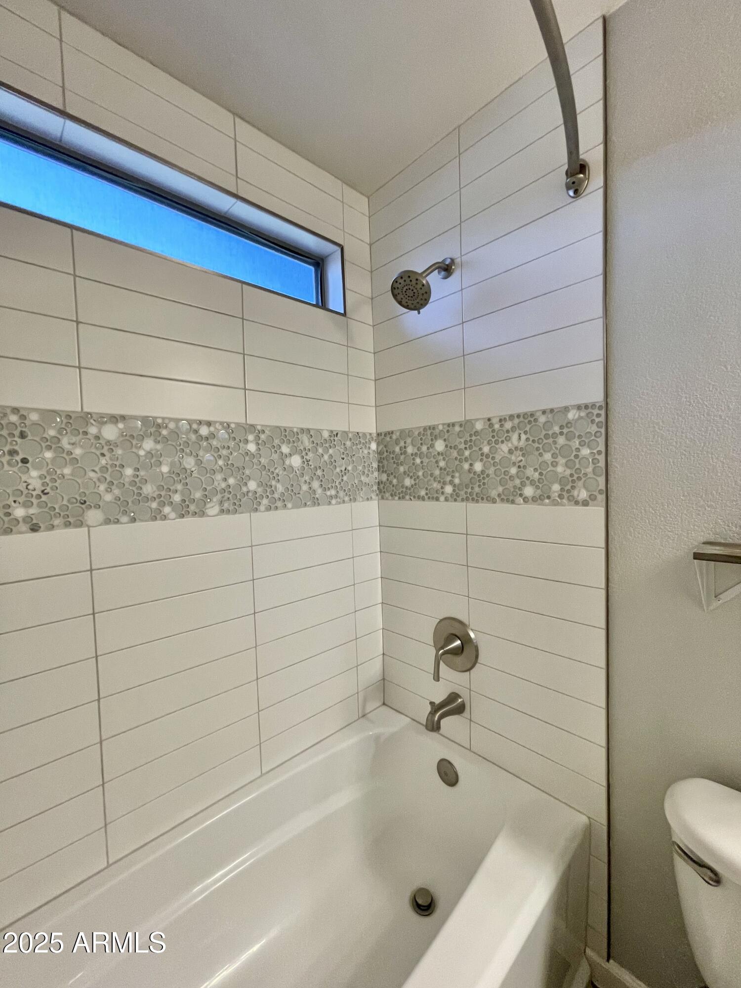 2640 East Indian Wells Place Chandler, AZ 85249 - Photo 22 of 40 a bathroom with a bathtub and shower