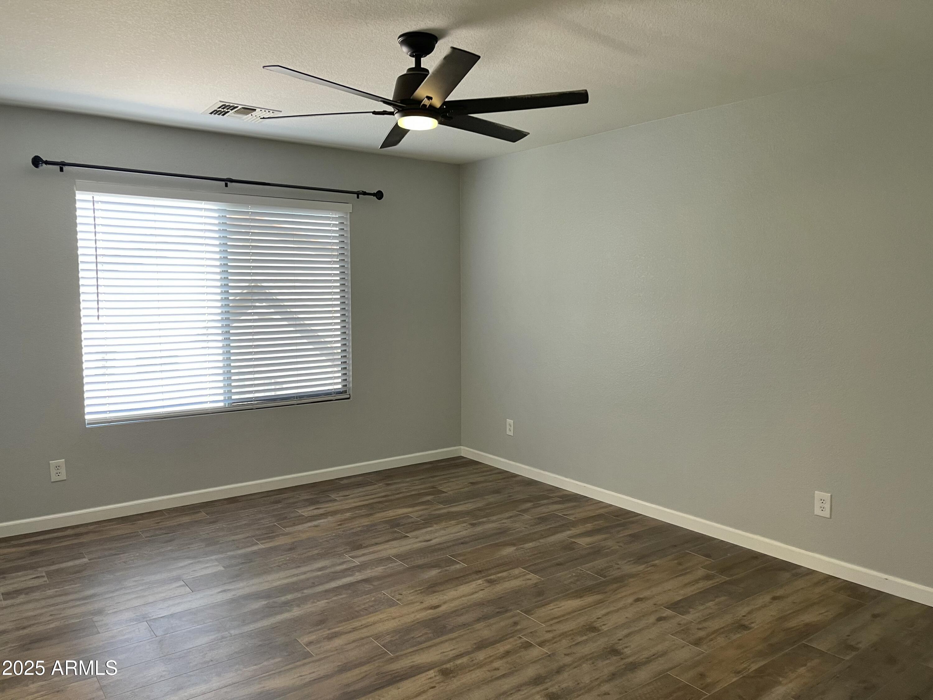 2640 East Indian Wells Place Chandler, AZ 85249 - Photo 25 of 40 a view of a room with wooden floor and a window