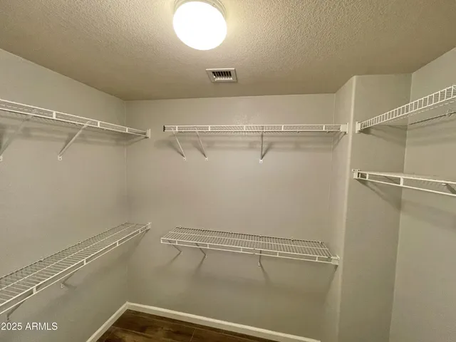 a view of a room with racks on the wall