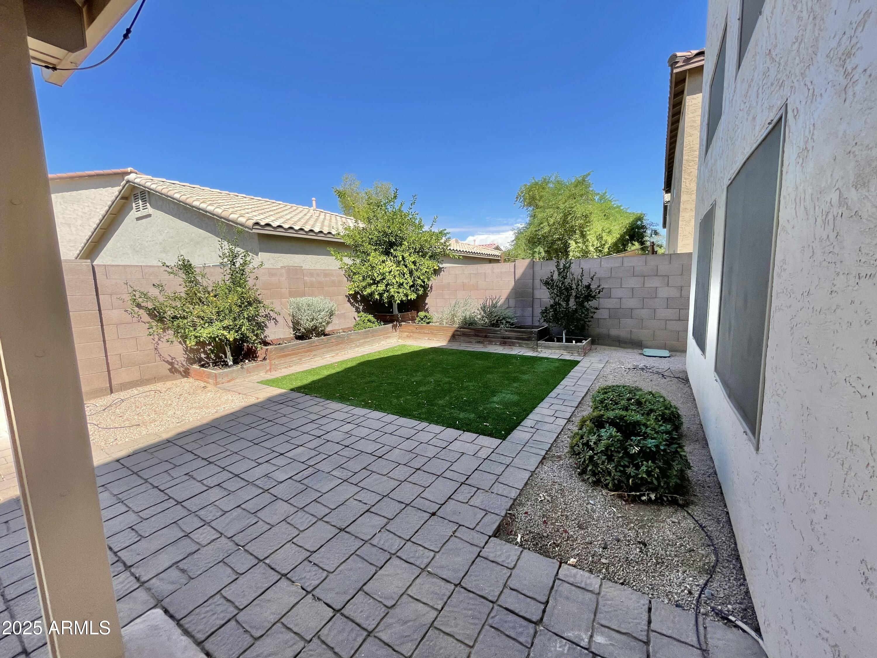 2640 East Indian Wells Place Chandler, AZ 85249 - Photo 34 of 40 a view of a garden with a pathway