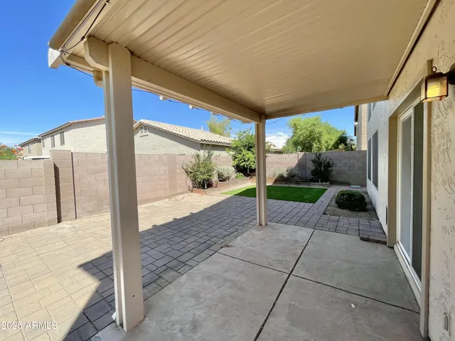 a view of a porch with wooden floor