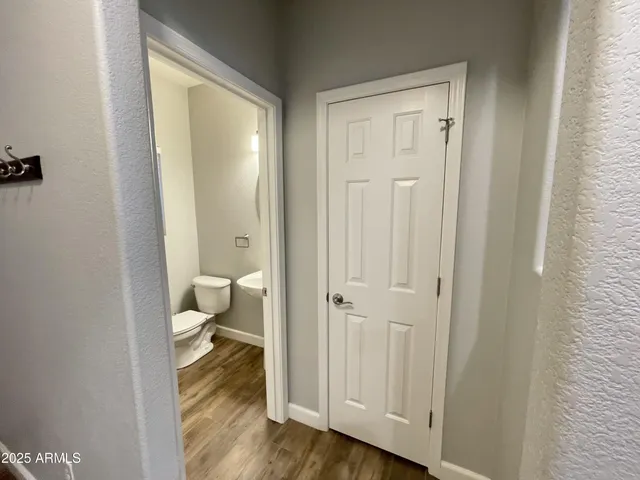 a bathroom with a toilet shower and a sink