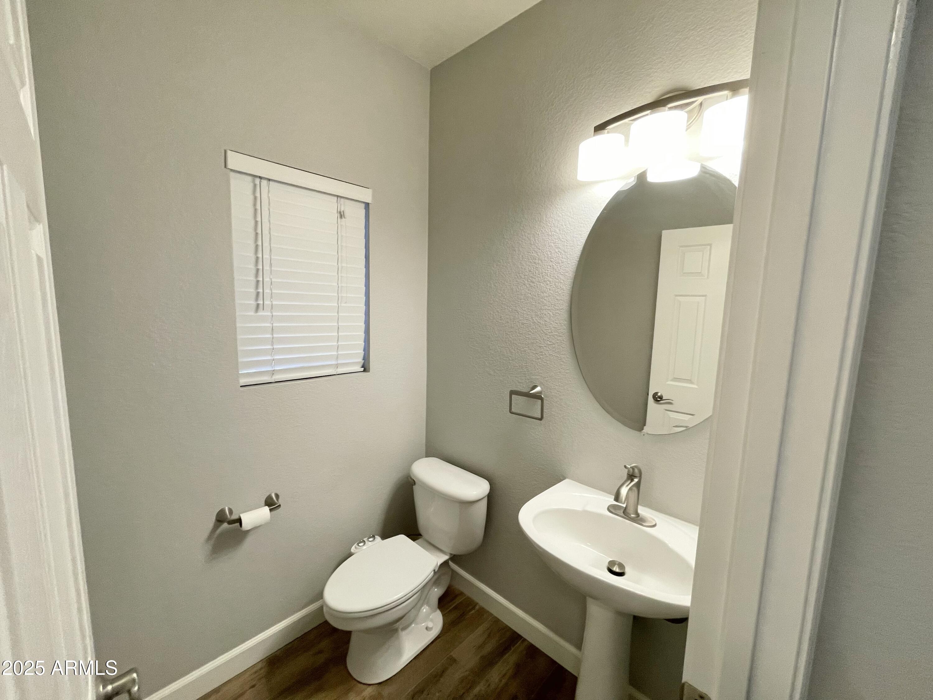 2640 East Indian Wells Place Chandler, AZ 85249 - Photo 6 of 40 a bathroom with a toilet sink and mirror