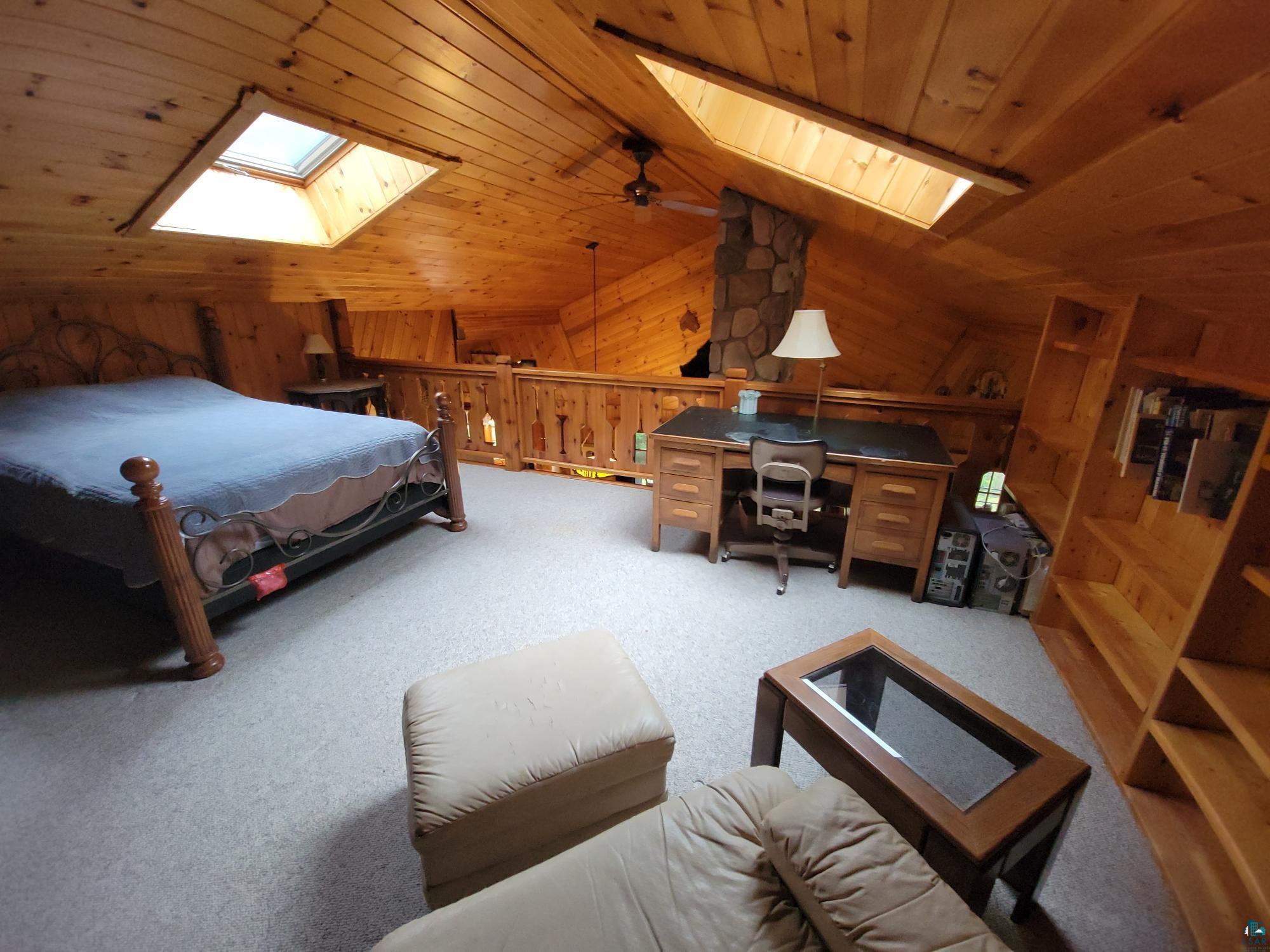 181 Linnell Road Grand Marais, MN 55604 - Photo 66 of 77 Vaulted wood-paneled ceilings with two skylights