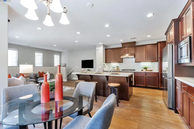 a large kitchen with a table and chairs